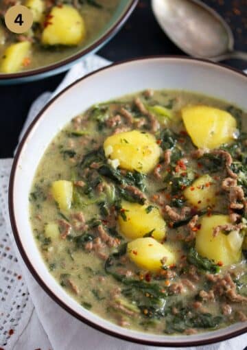 curry with chunky potatoes and beef in a bowl.