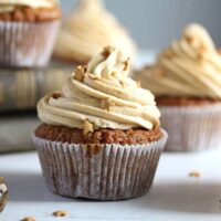 butterscotch cupcakes frosted and sprinkled with golden stars.