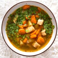 soup with chicken breast and vegetables in a bowl.