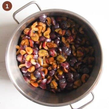 chopped italian plums in a pot before starting to cook them for jam.