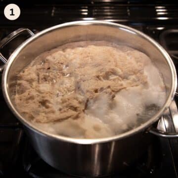 Foam forming on top of pork rib soup while cooking.