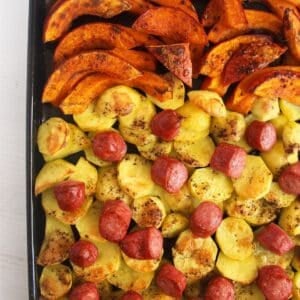 pumpkin sausage potato recipe cooked on a large sheet pan.