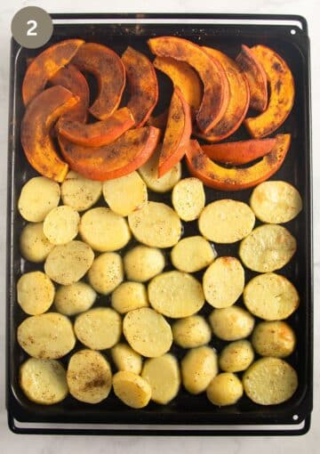 half-baked potato and pumpkin slices on a baking sheet.