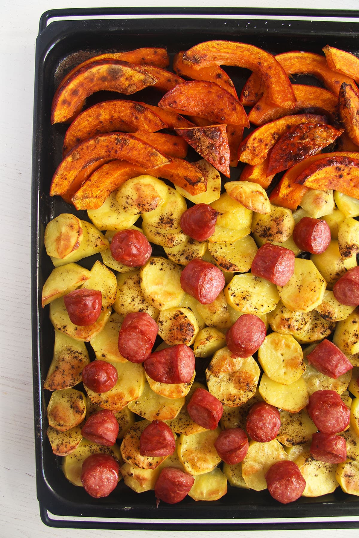 golden baked pumpkin sausage and potato sheet pan.