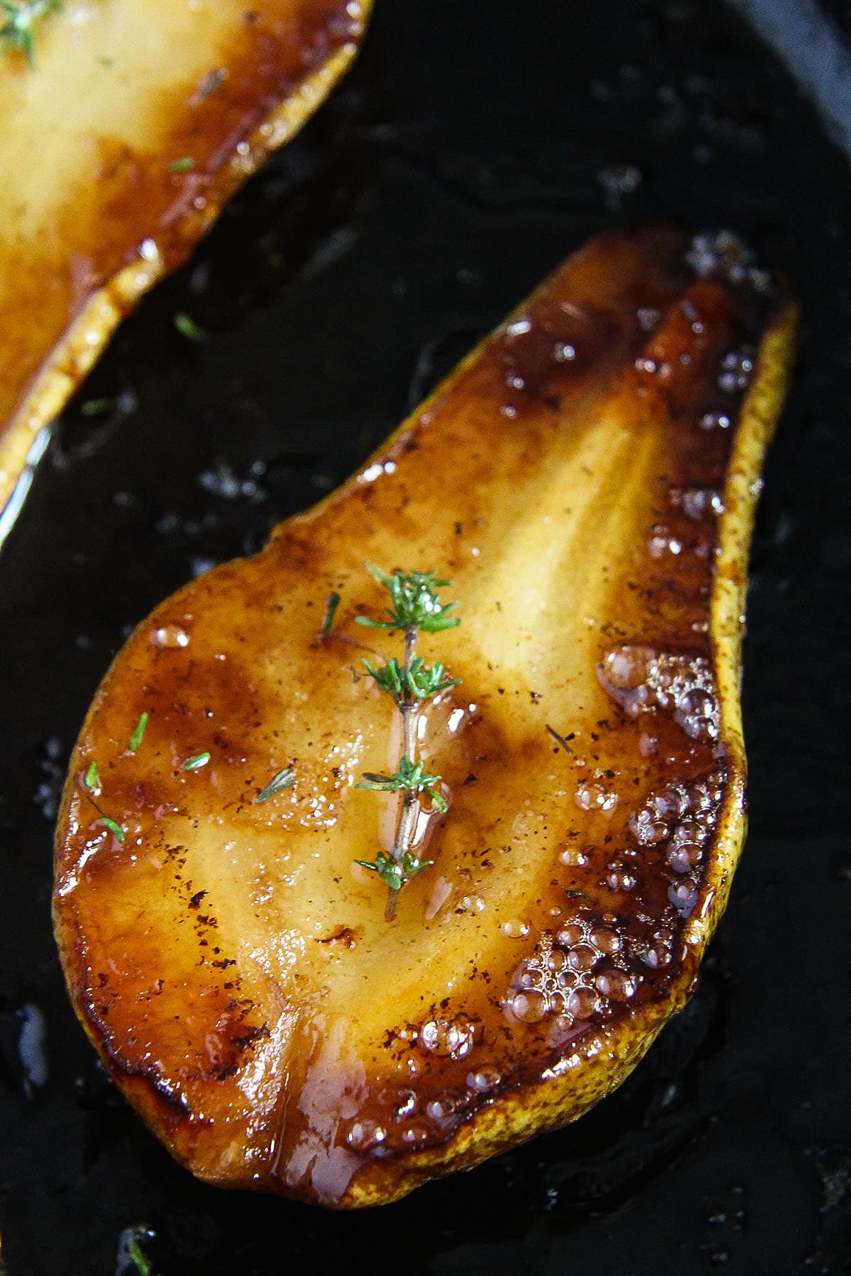 one golden brown and caramelized roasted pear.