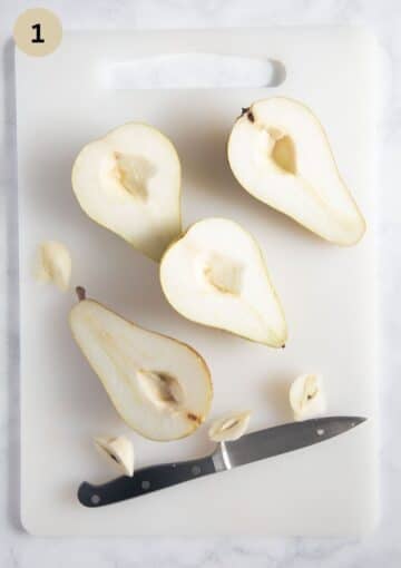 removing the core from four pear halves with a small knife.