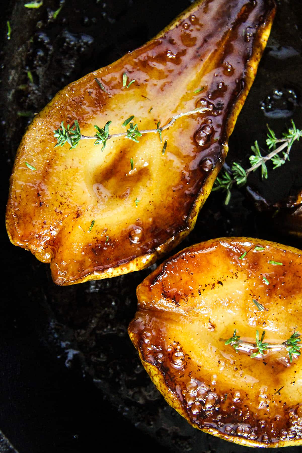 roasted pears with honey and balsamic and a sprig of thyme.