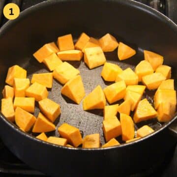 adding sweet potato cubes to a hot cast iron skillet.
