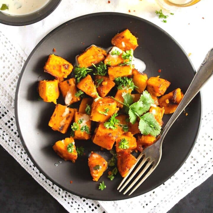 sauteed sweet potatoes served with tahini sauce and cilantro