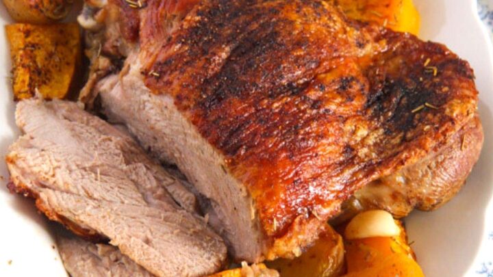 oven-roasted turkey thigh served with potatoes and pumpkin.