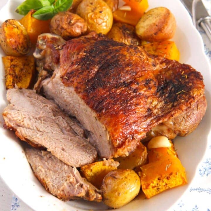 oven-roasted turkey thigh served with potatoes and pumpkin.