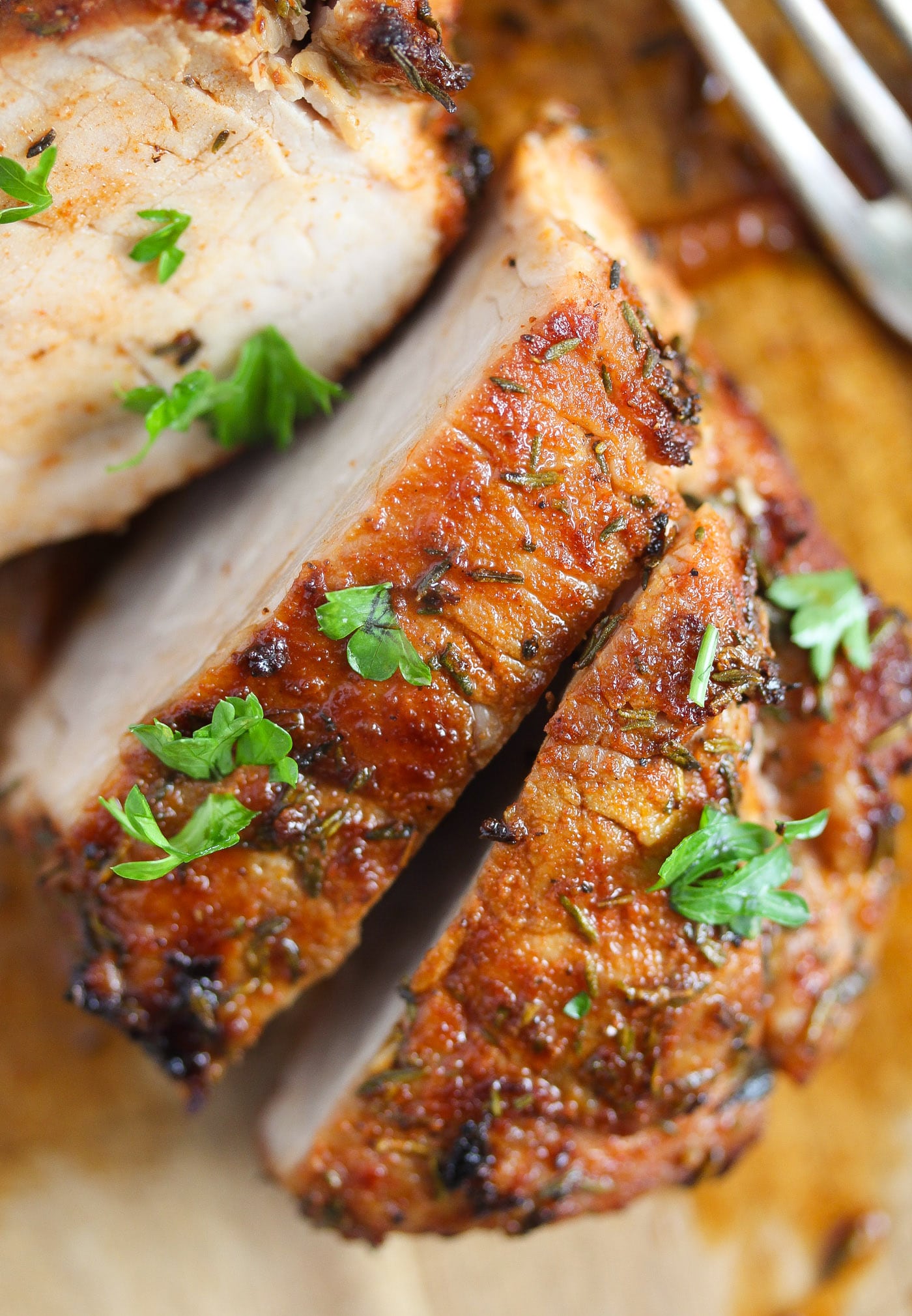 piece of tenderloin sprinkled with parsley close up