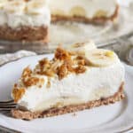 a super creamy slice of banana caramel cream pie on a small plate.