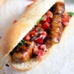 choripan con chimichurri sandwich with salsa, uruguayan style.