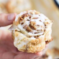hand holding one puff pastry walnut swirl.