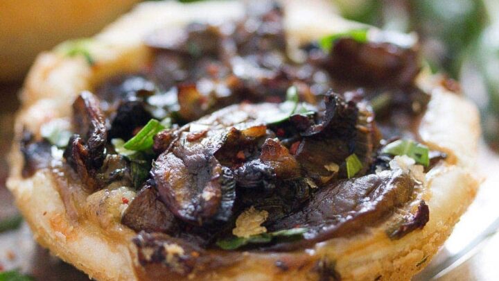 mushroom pies with parmesan sprinkled with herbs.