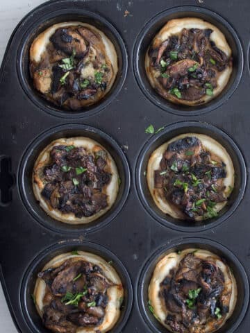 mushroom tarts in a muffin tin after.