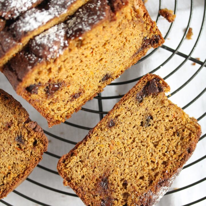 sliced squash bread with chocolate chips on a wire rack.