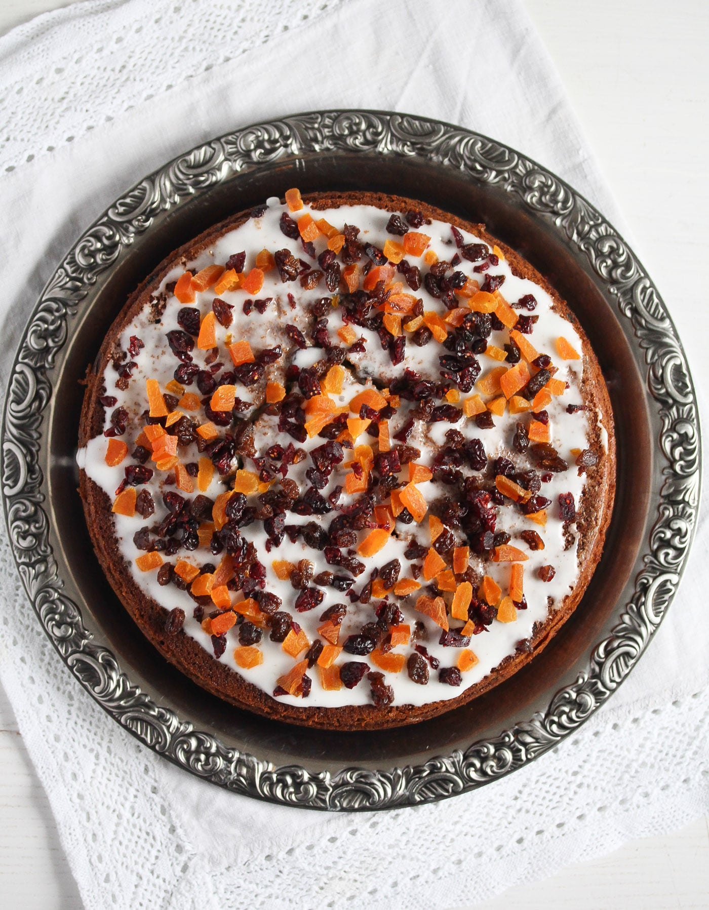pumpkin fruit cake with icing and dried fruit topping