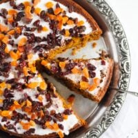 sliced large fruitcake with pumpkin puree on a silver platter