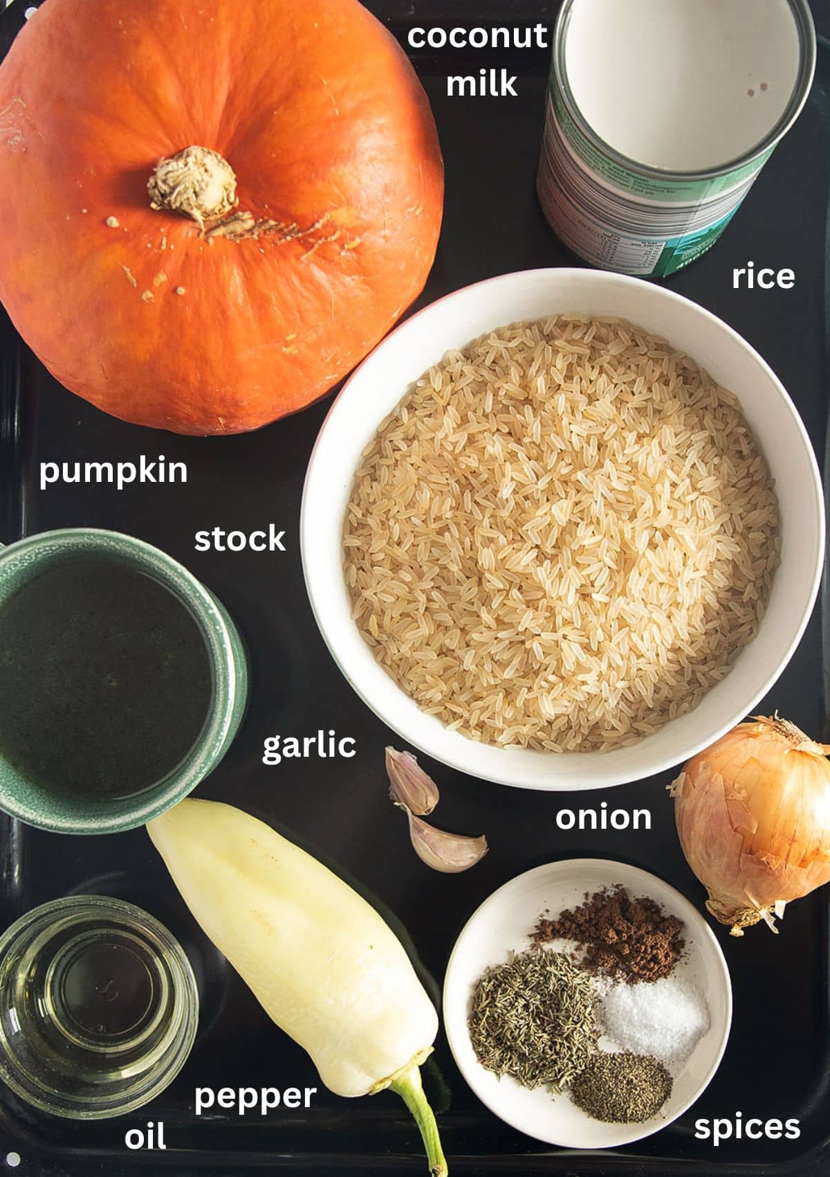 labeled ingredients for making rice with pumpkin, spices, pepper, and coconut milk.