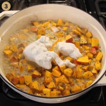 adding coconut milk to pumpkin cubes in a pot.