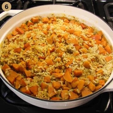 freshly cooked pumpkin rice in a large pot.