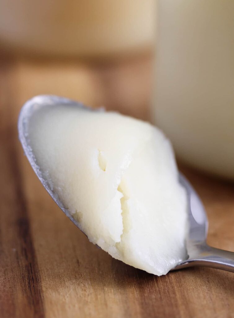 solid white fat on a spoon