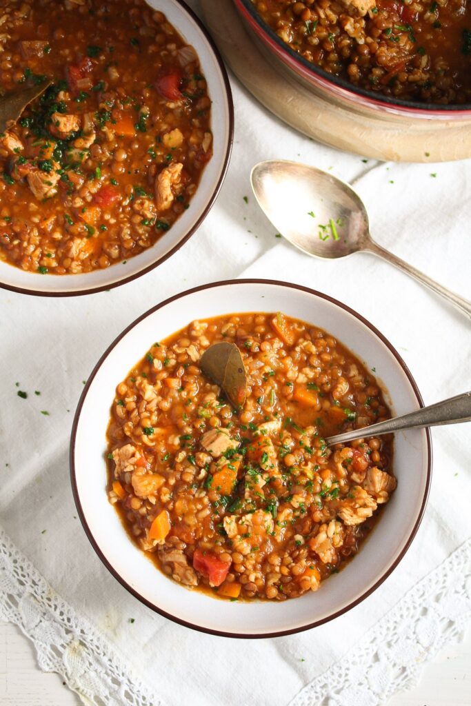 overhead shot of lentil turkey soup in bowls