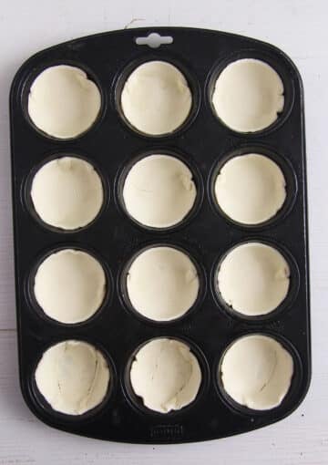 puff pastry round pressed into muffin molds.