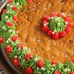 pinterest image of cookie cake decorated for christmas.