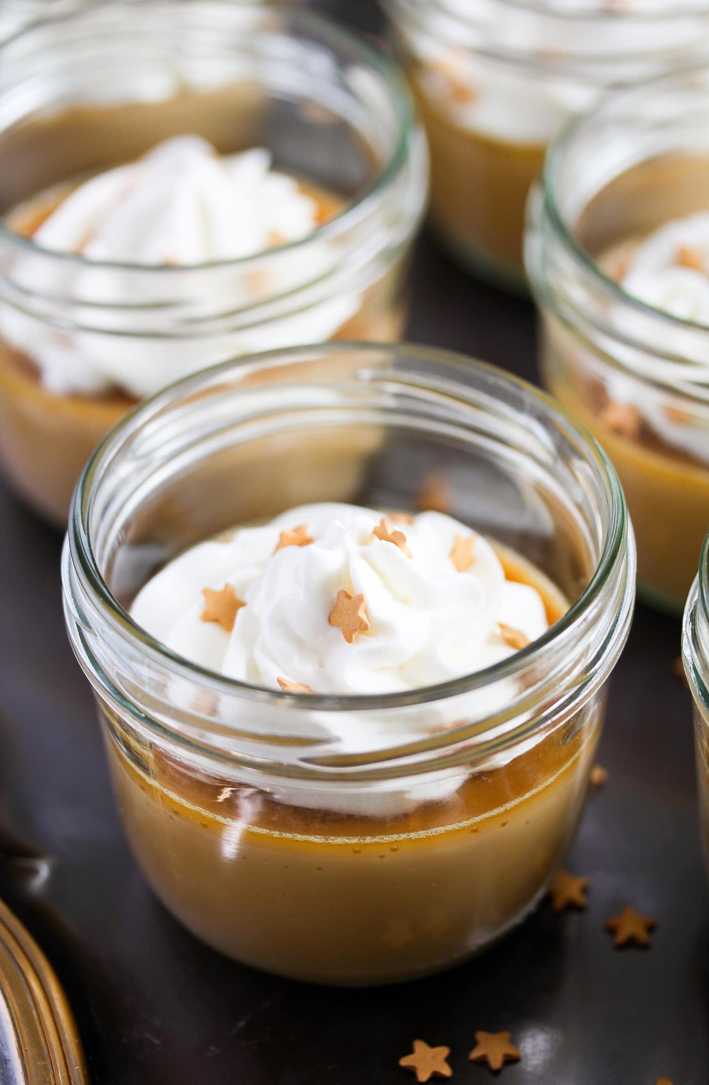 caramel custards in small jars sprinkled with little stars
