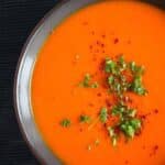 pinterest image with the title butternut squash and red pepper soup.
