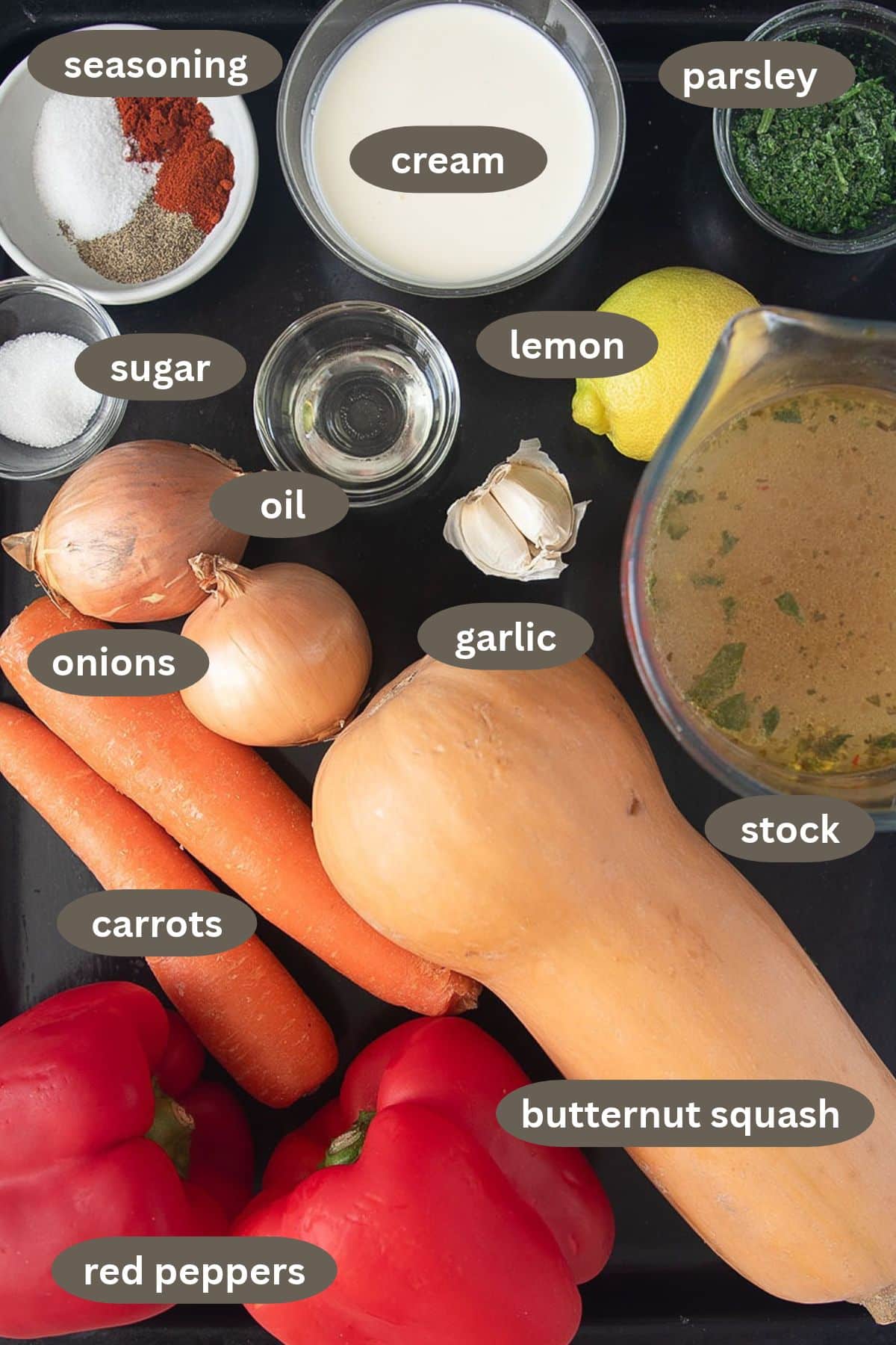 labeled ingredients for making soup with butternut squash, red peppers, and carrots.