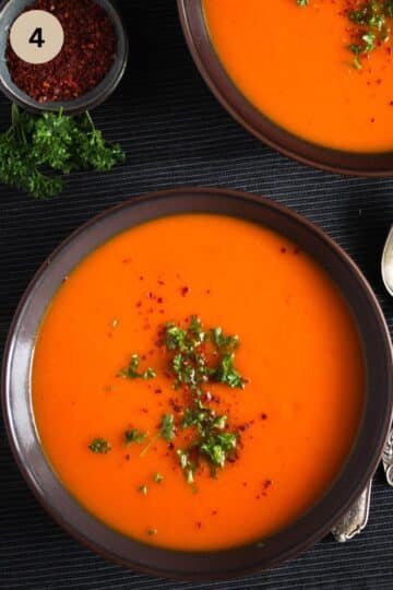 two bowls with soup with sqush, peppers, and carrots.