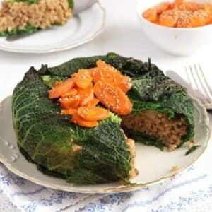 round stuffed cabbage cake with risotto fillling and carrot topping.