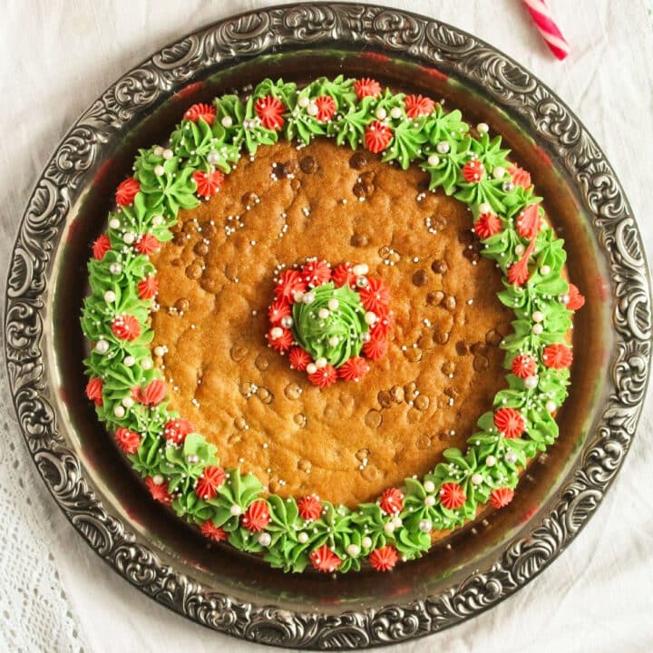 overhead view of christmas cookie cake decorated with buttercream green wreath.