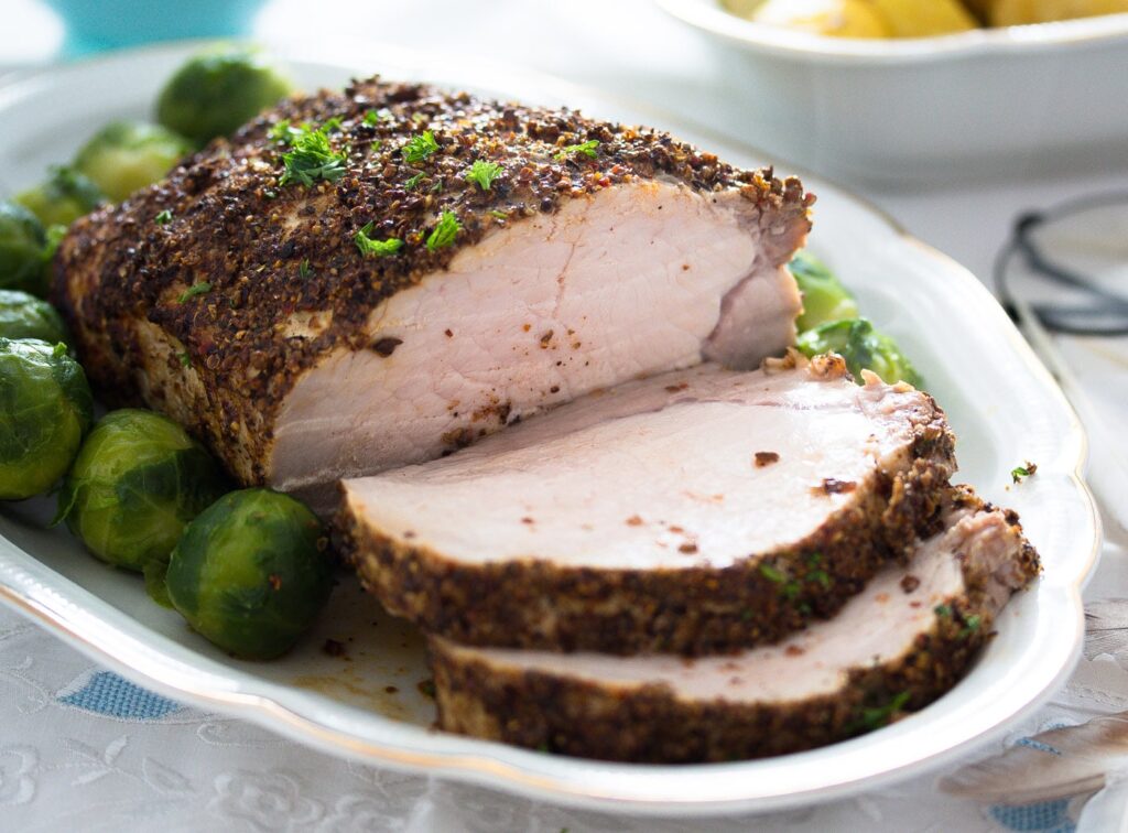 sliced pork roast crusted with spices