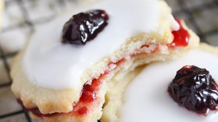 close up of a german biscuit filled with raspberry jam