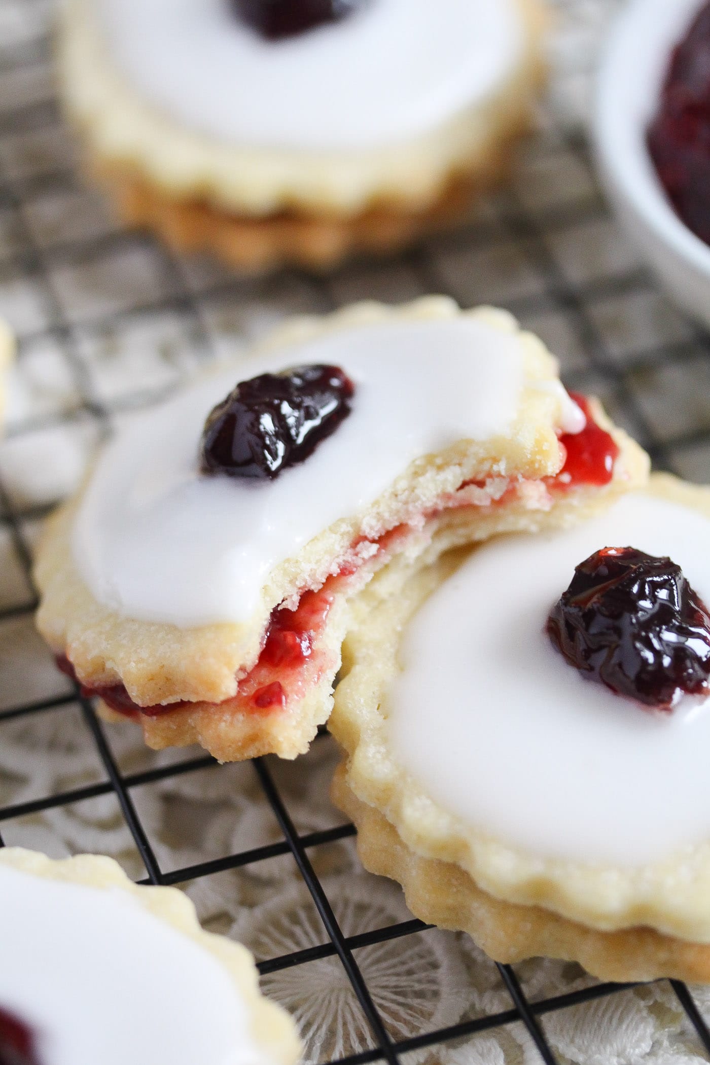 close up of a german biscuit filled with raspberry jam