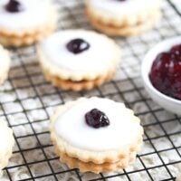 empire biscuits filled with jam on a wire rack