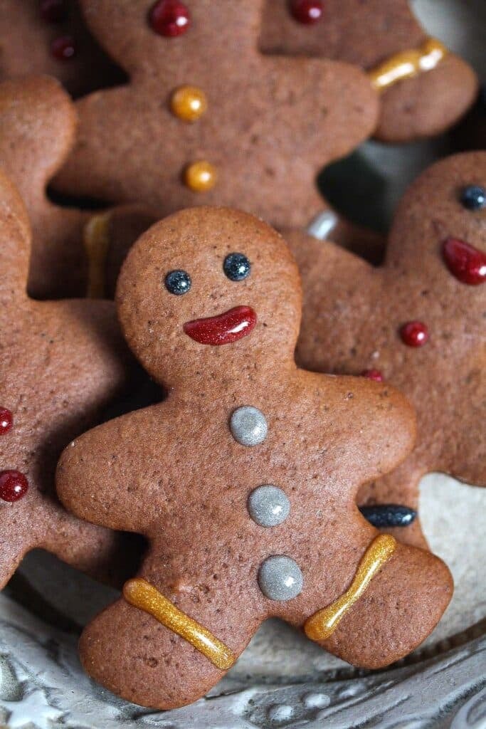 cute gingerbread men smiling on a plate