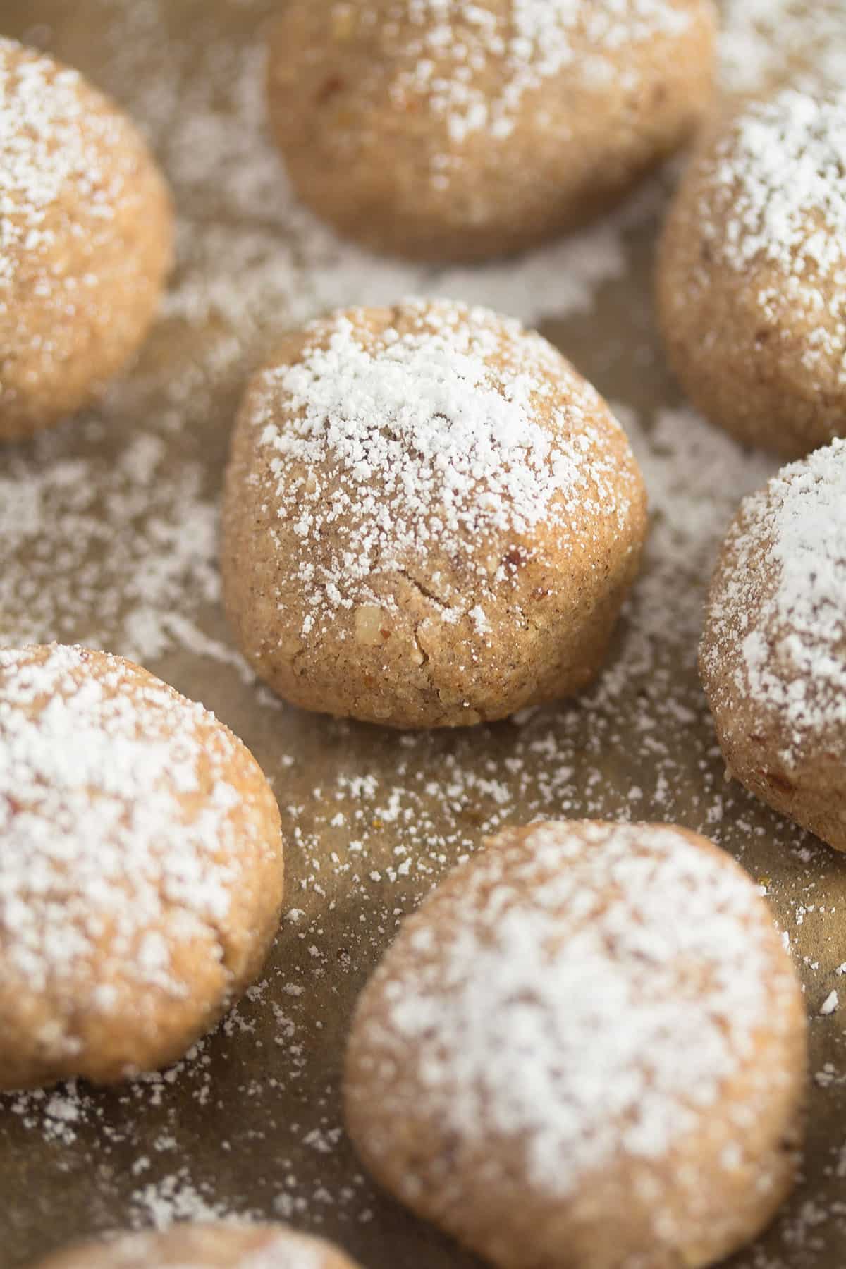 many small polvorones cookies sprinkled with powdered sugar.