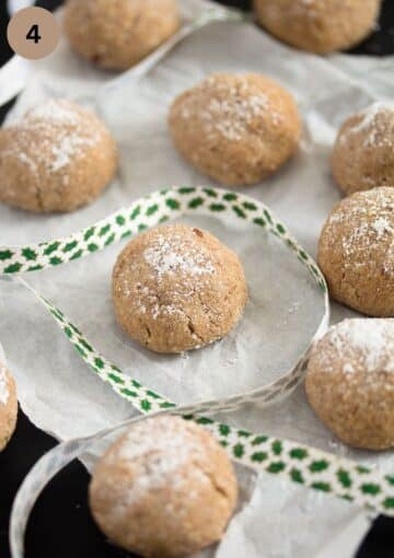 many polvorones cookies on a table cloth with a ribbon around them.