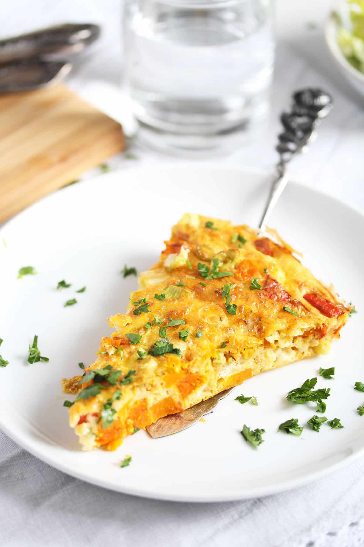 one slice of frittata with pumpkin in a plate.