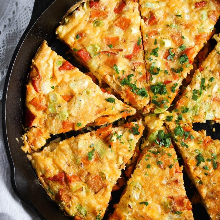 sliced frittata with pumpkin in a cast iron skillet