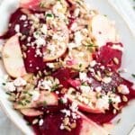 pin image with the title raw beet feta salad.