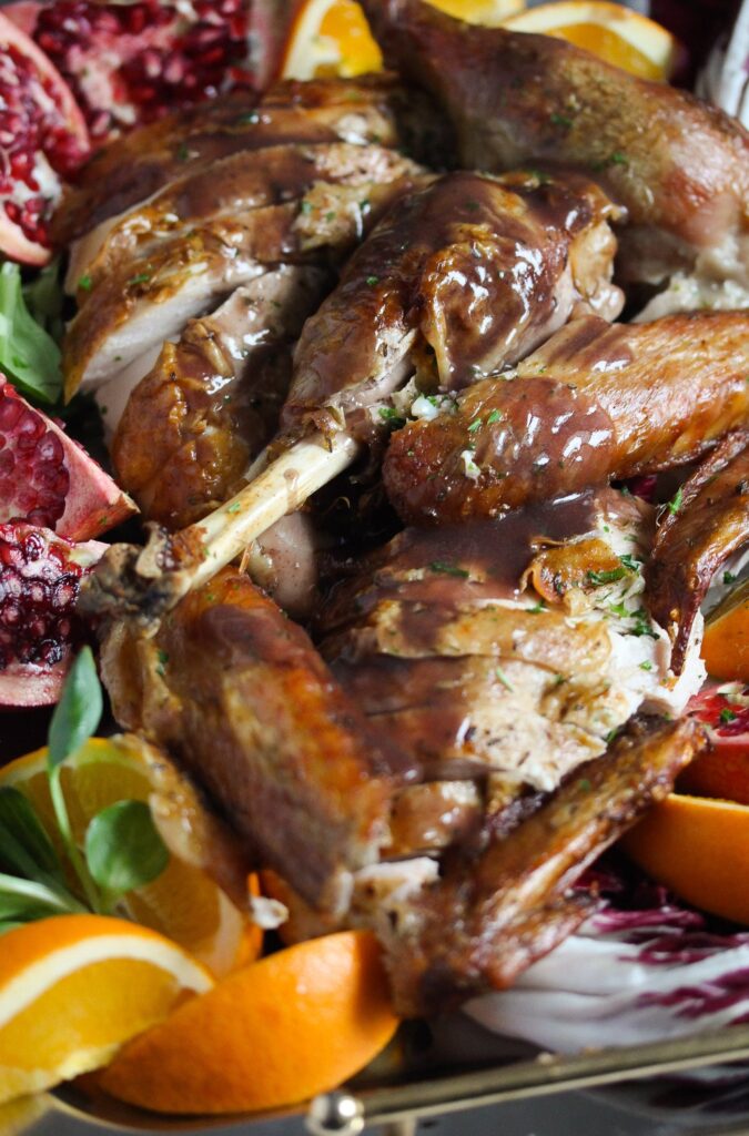 platter with carved turkey and orange slices