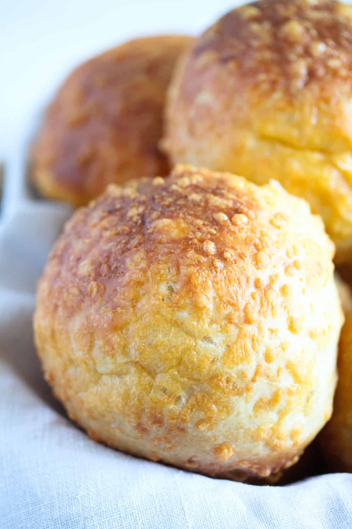 golden homemade buns stuffed and then rolled in cheese.