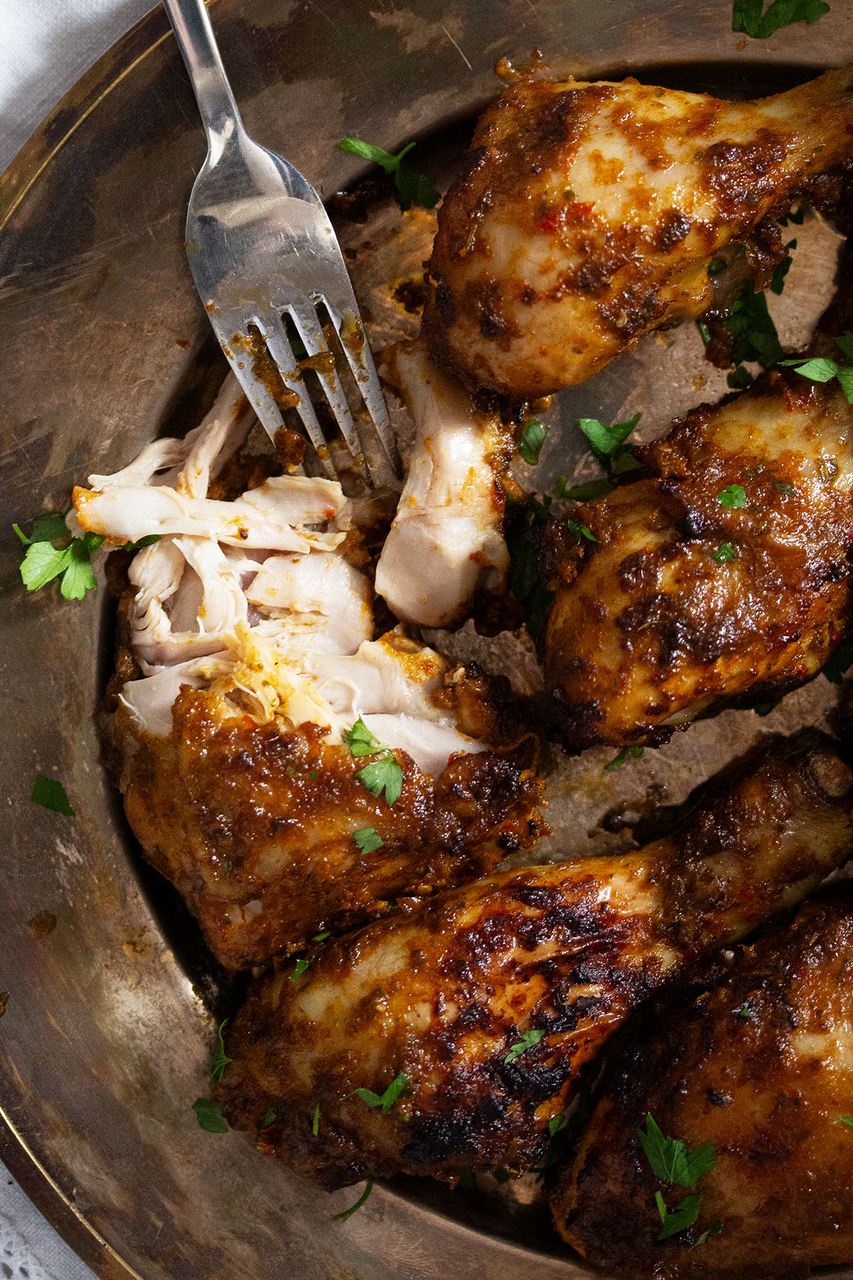 nando's chicken, one thighs torn to show the flesh.